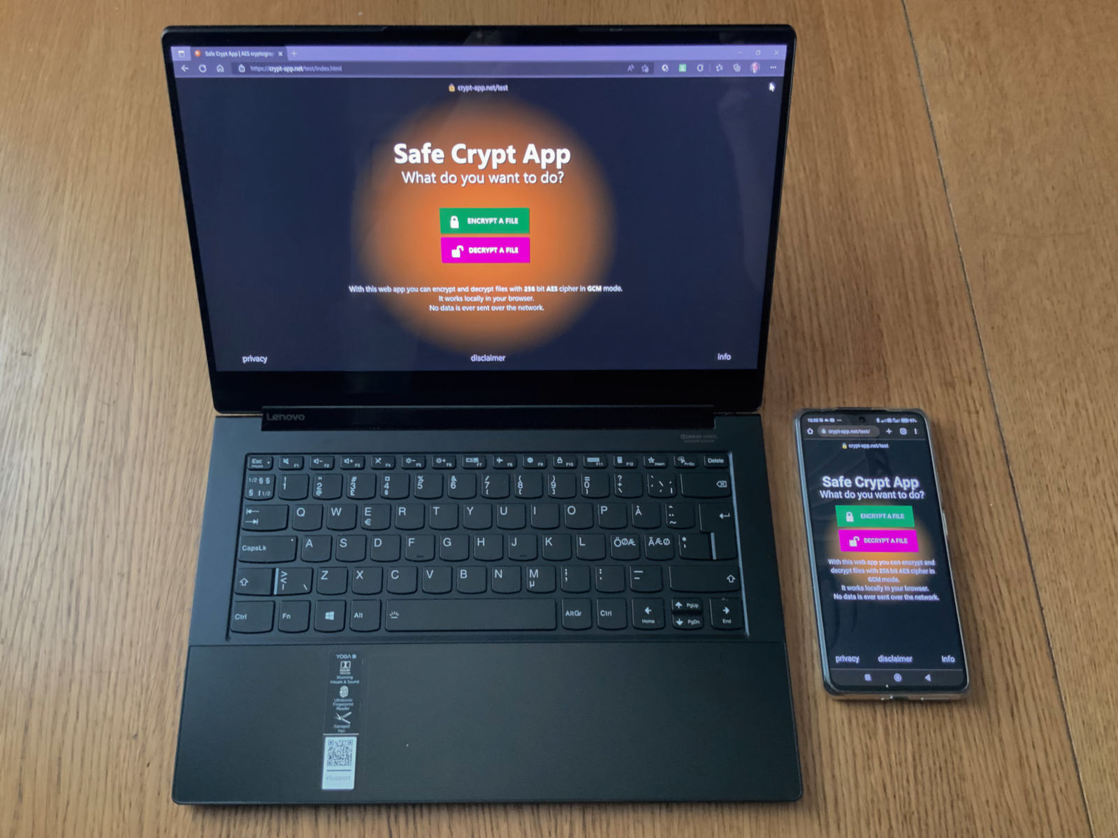 A laptop and a phone showing Safe Cryptography App